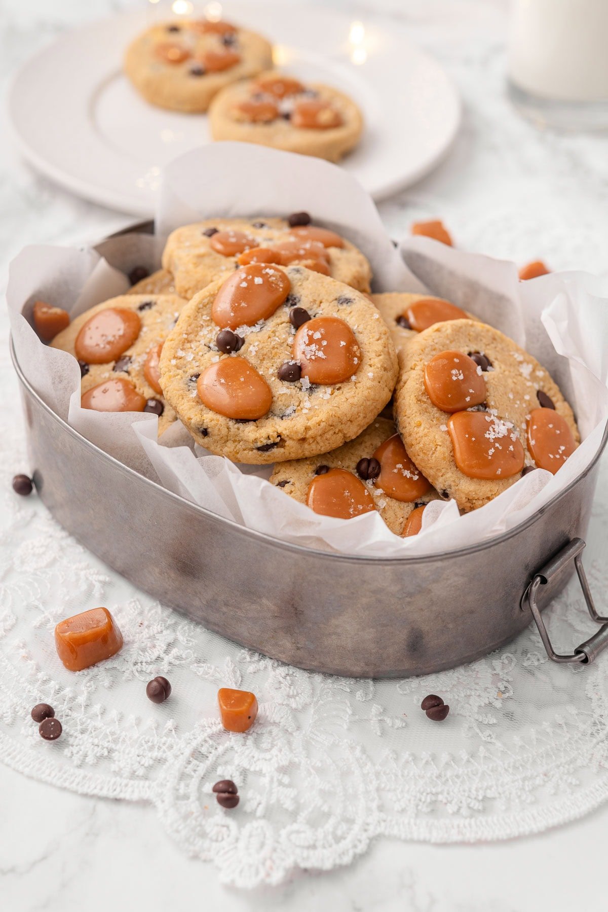 Salted caramel chocolate chip chickpea cookies in a metal serving fish.
