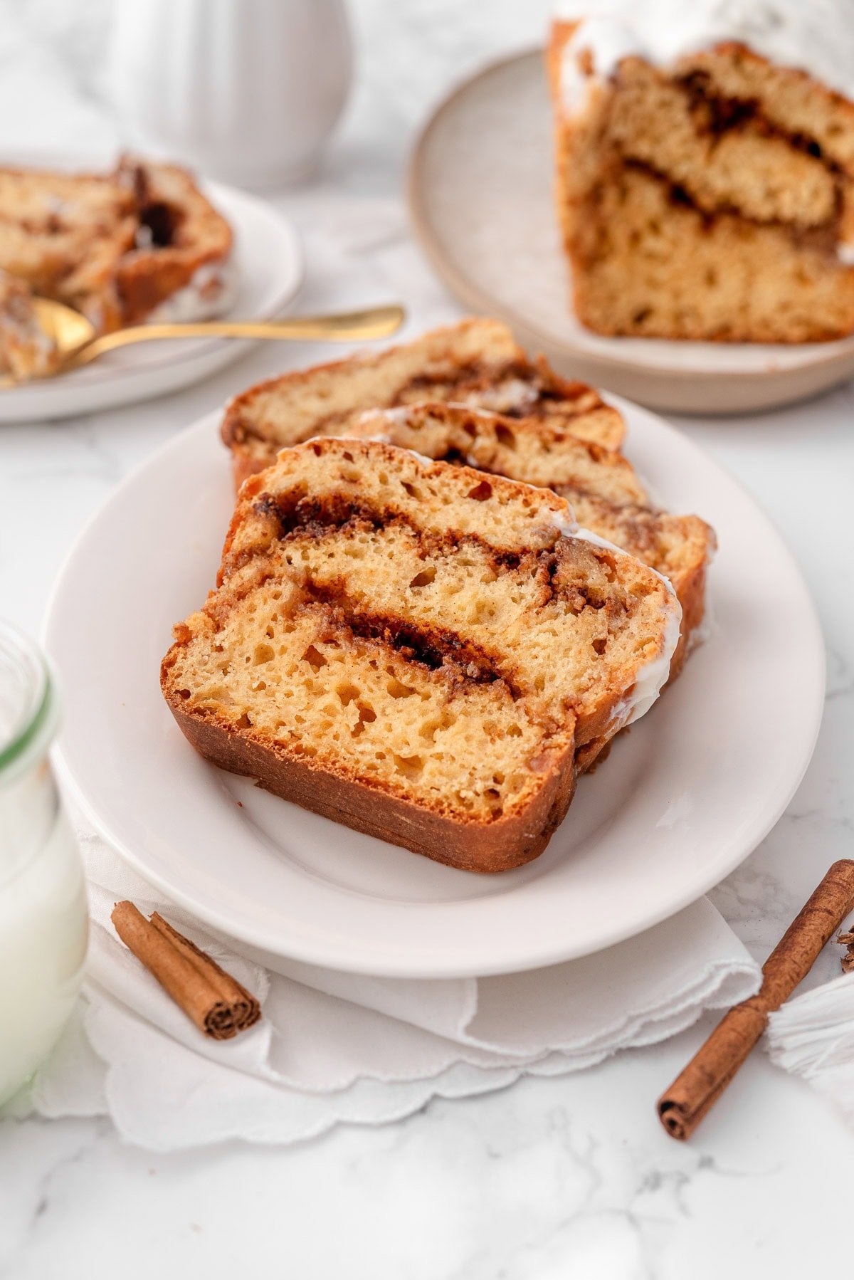 Slices of Greek yogurt cinnamon roll bread on a plate.