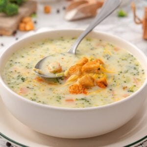 High protein broccoli cheddar soup with chicken in a bowl.