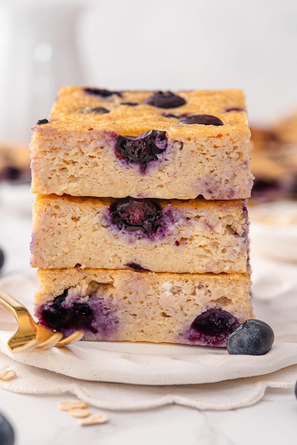 Blueberry cottage cheese breakfast bake slices stacked on top of each other.