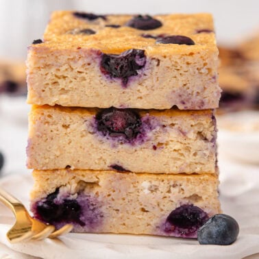 A stack of blueberry cottage cheese breakfast bake slices.