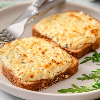 Cottage cheese toast on a plate.