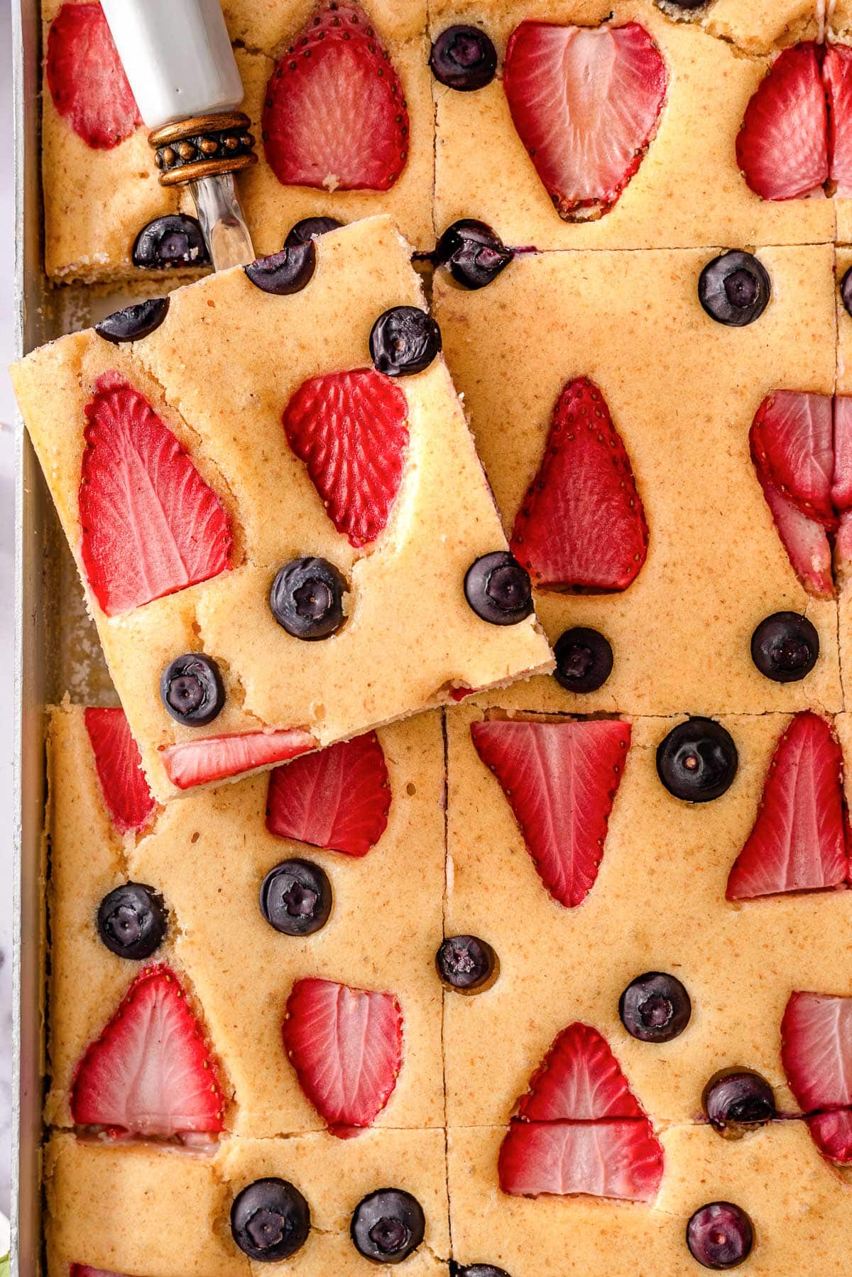 Kodiak sheet pan pancakes with blueberries and strawberries.