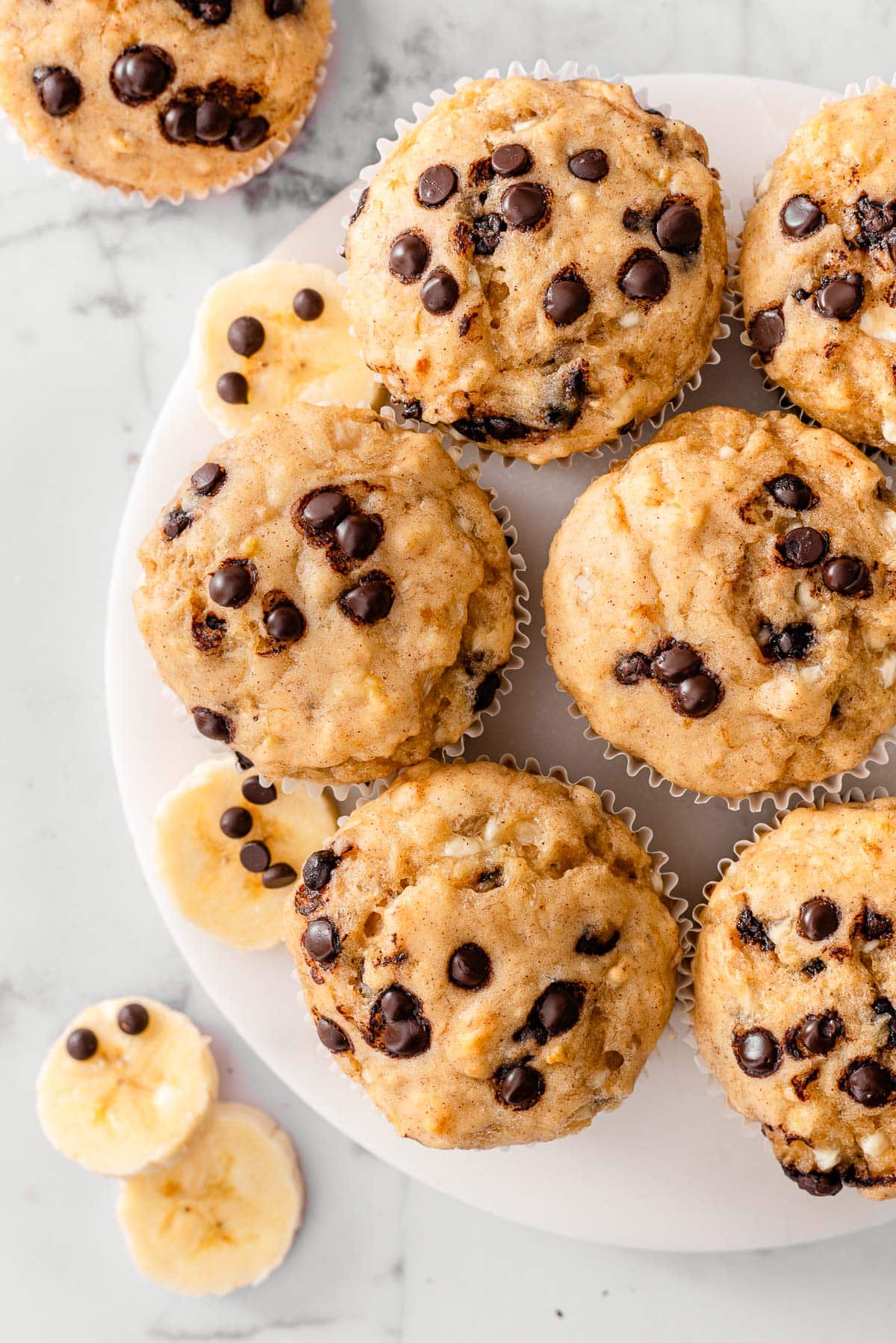 Cottage cheese banana muffins with chocolate chips on a platter.
