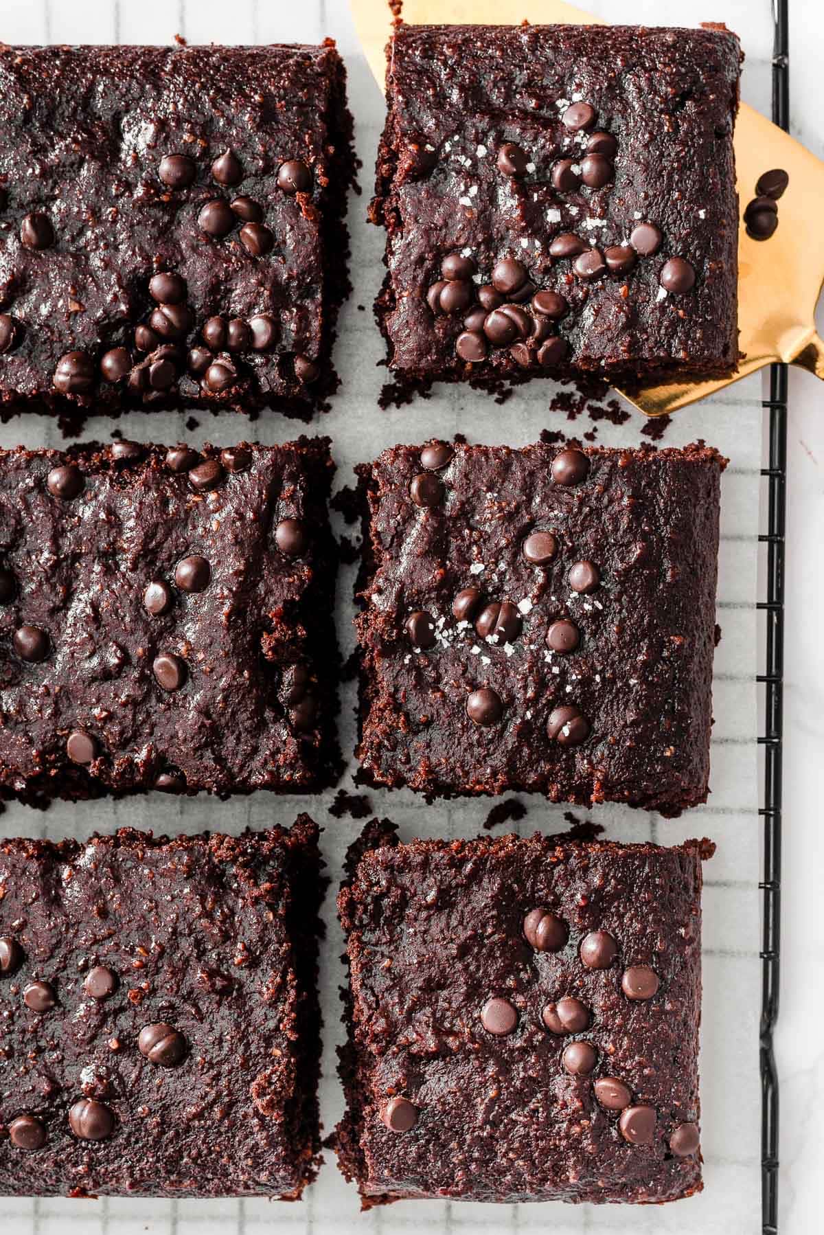 Looking down on healthy brownies garnished with sea salt flakes.