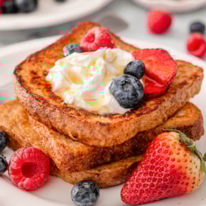 High protein french toast with greek yogurt, syrup and berries.