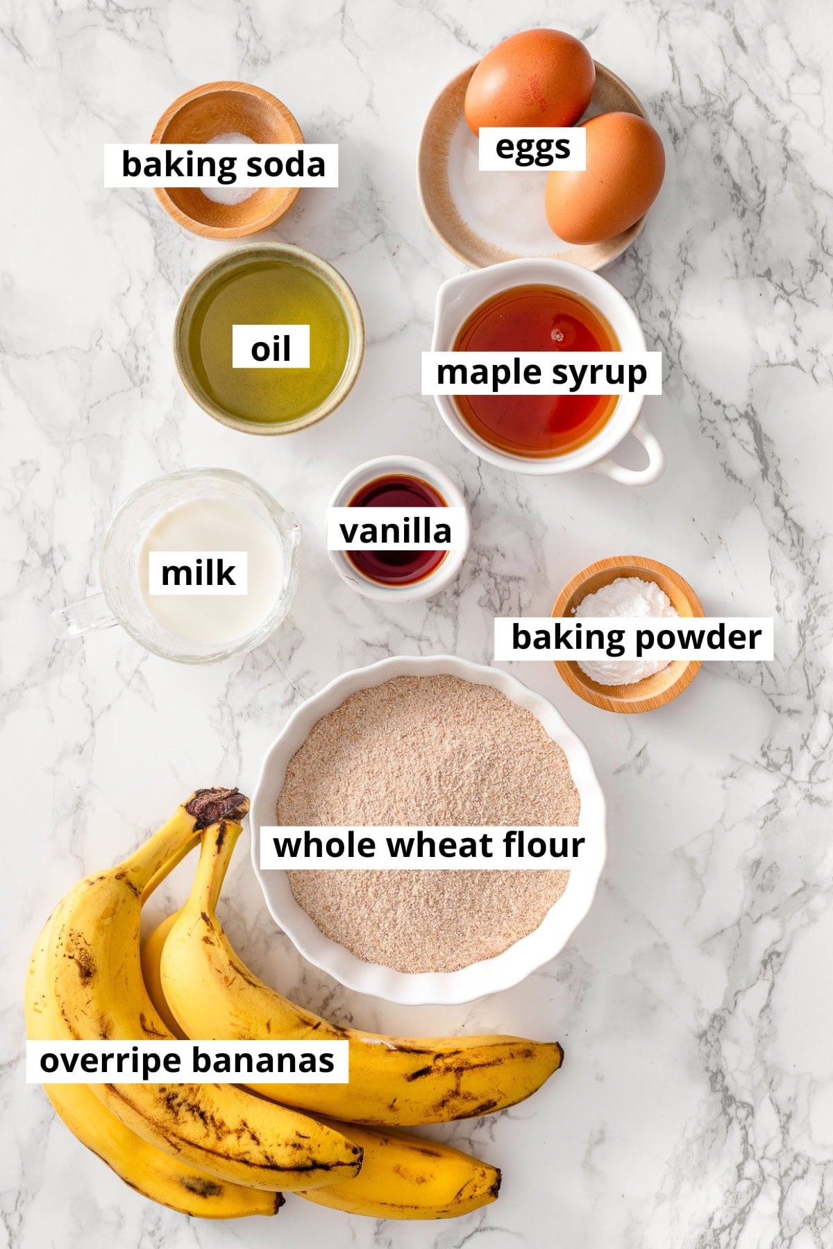 Bananas, maple syrup, whole wheat flour, eggs, milk, baking powder, baking soda, cinnamon, vanilla, salt, oil.