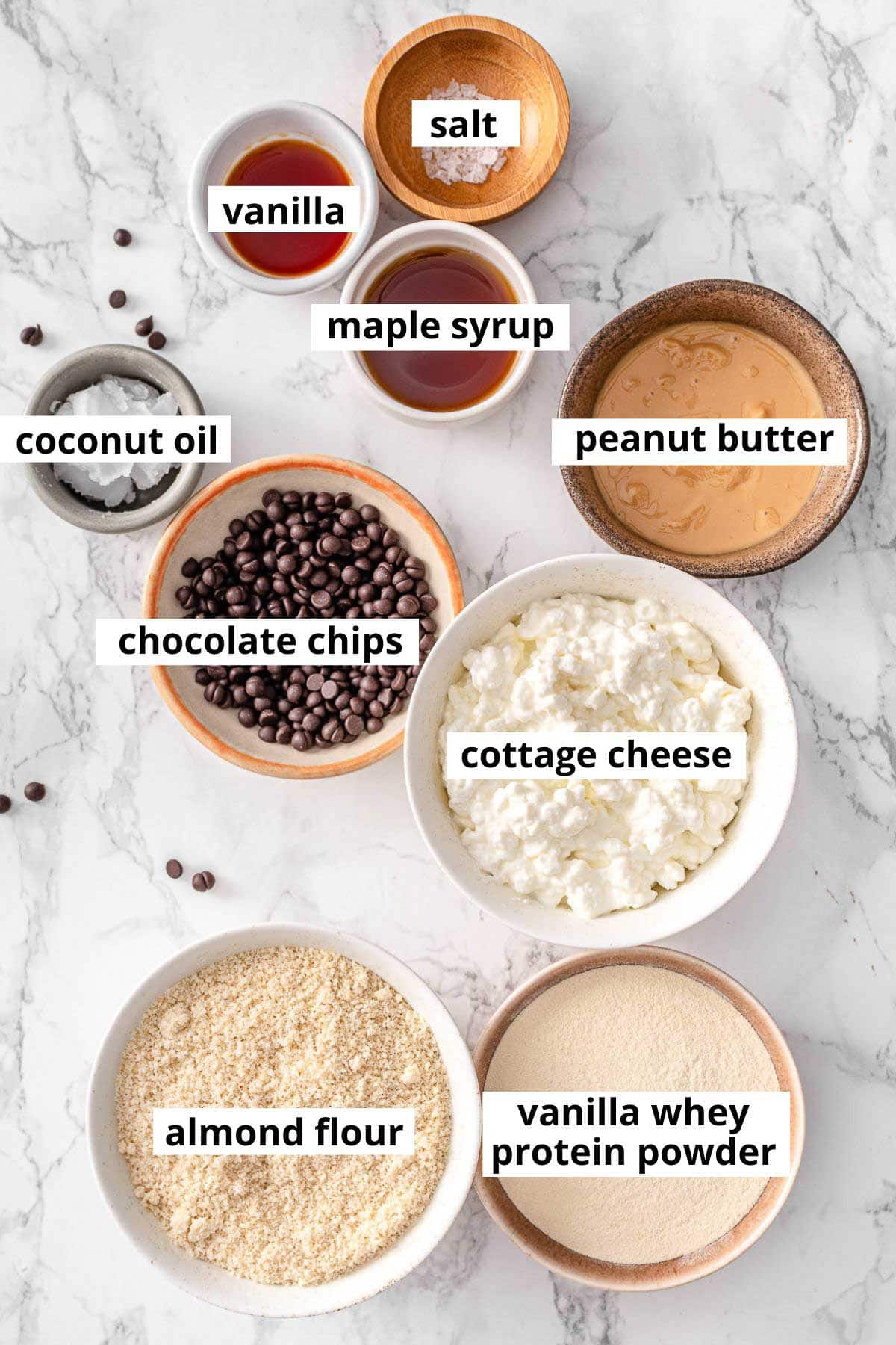 Cottage cheese, vanilla protein powder, almond flour, peanut butter, vanilla, maple syrup, salt, coconut oil, chocolate chips.