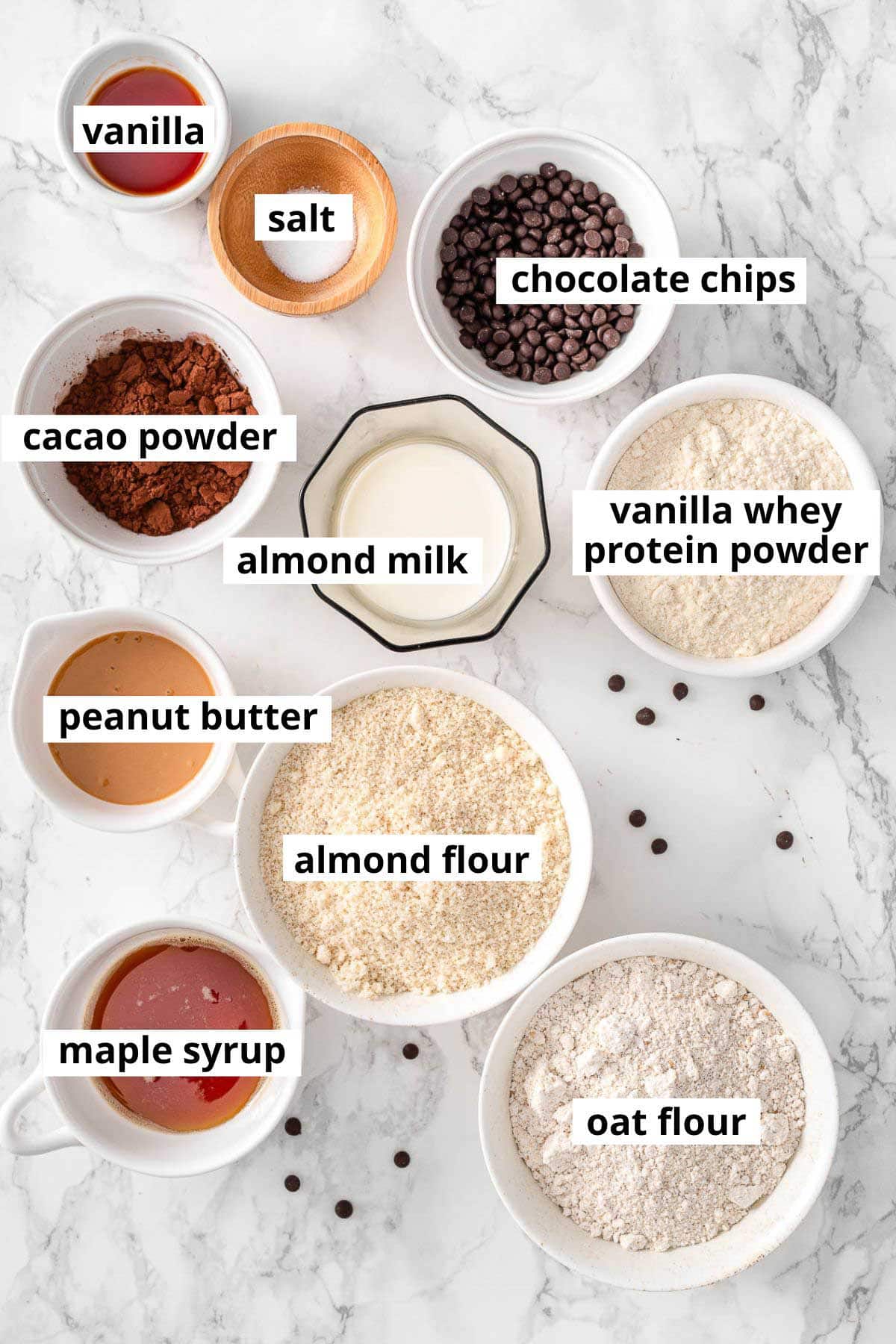 Whey protein powder, almond flour, oat flour, peanut butter, almond milk, maple syrup, vanilla, salt, cacao powder, chocolate chips.