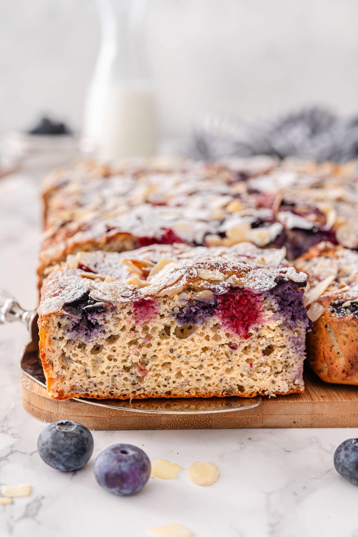 Almond croissant kodiak pancake breakfast casserole dusted with sugar and sliced.