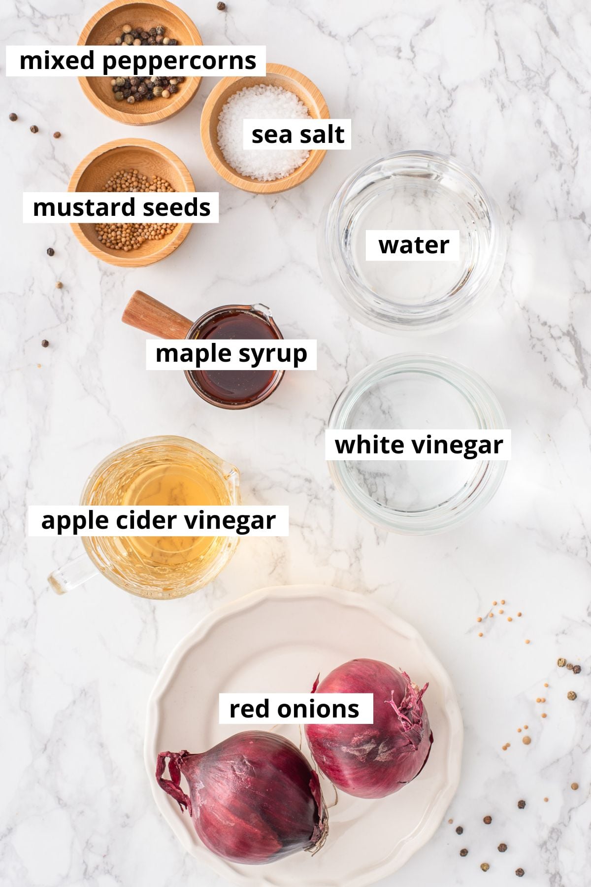 Red onions, white vinegar, apple cider vinegar, salt, maple syrup, water, mustard seeds, peppercorns.
