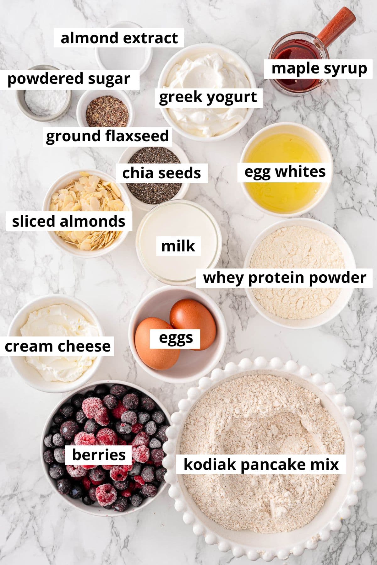Kodiak pancake mix, whey protein powder, eggs, egg whites, greek yogurt, maple syrup, flaxseed, chia seeds, powdered sugar, almonds, almond extract, milk, cream cheese, berries.